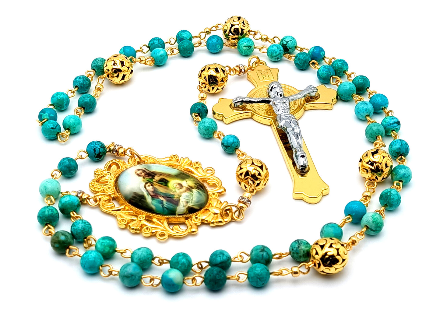 The Nativity unique rosary beads with turquoise gemstone and gold plated Bali beads and Holy Family medal and Saint Benedict gold and silver crucifix.