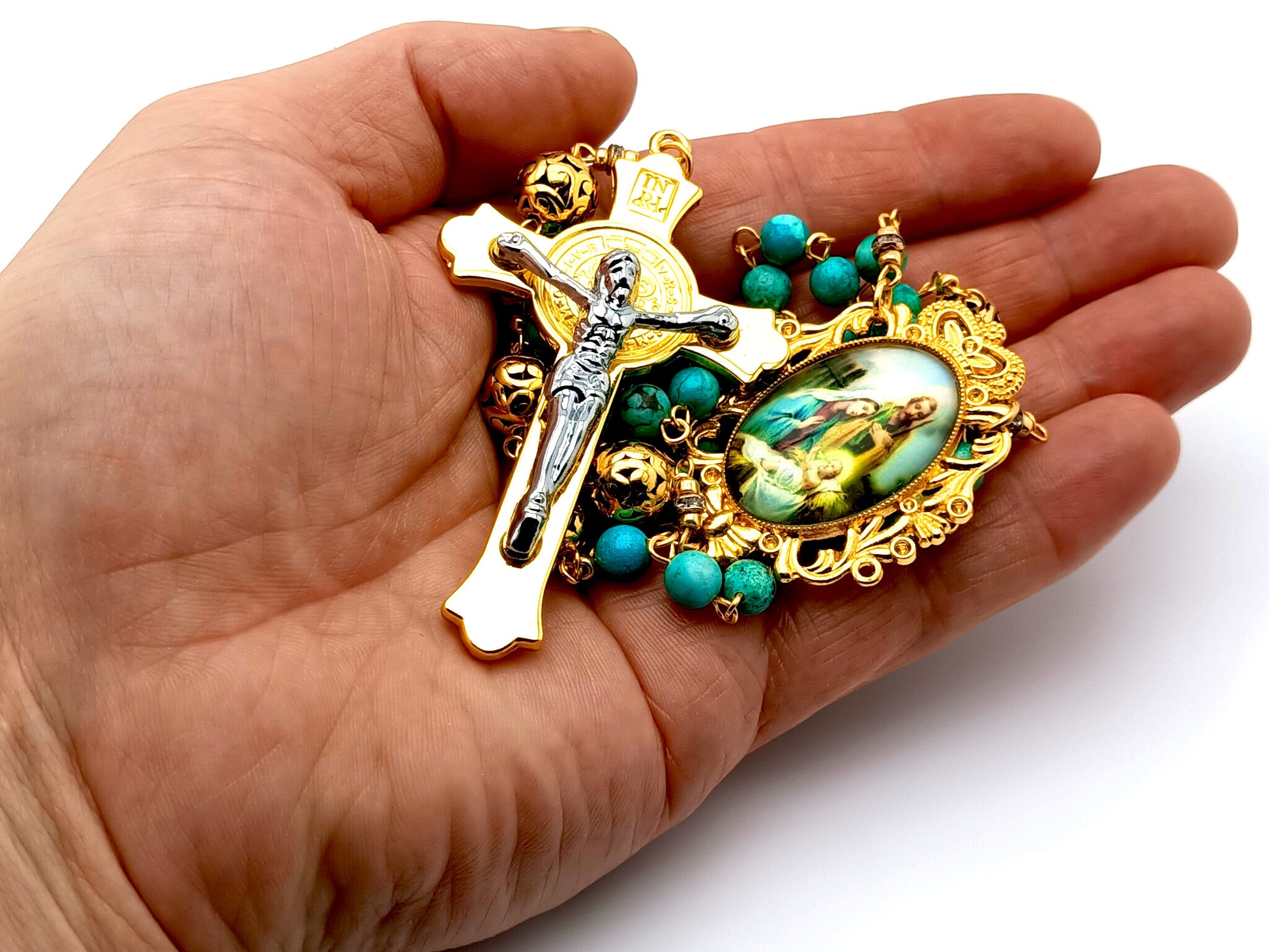 The Nativity unique rosary beads with turquoise gemstone and gold plated Bali beads and Holy Family medal and Saint Benedict gold and silver crucifix.