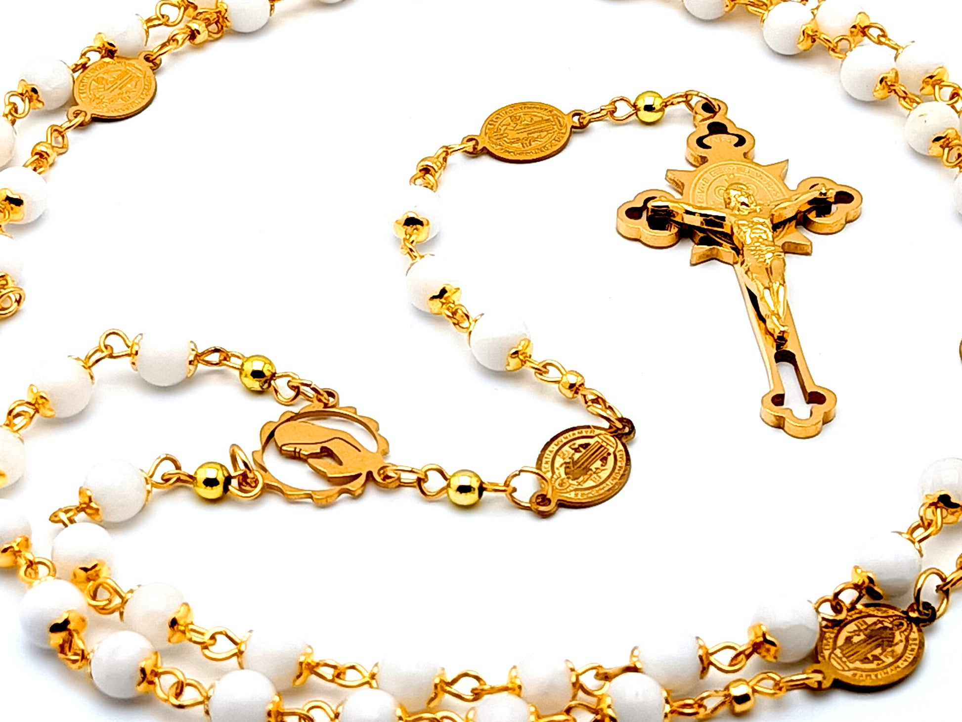 Virgin Mary unique rosary beads with gold and mother of pearl beads and Saint Benedict linking medals and gold plated Saint Benedict engraved crucifix.
