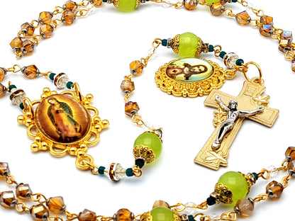 Our Lady of Guadalupe unique rosary beads with glass and gemstone beads and Sacred Heart gold medal and lily crucifix.