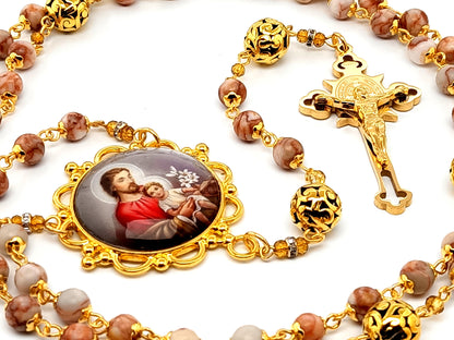Saint Joseph unique rosary beads with dragons vein gemstone beads and gold engraved Saint Benedict crucifix.