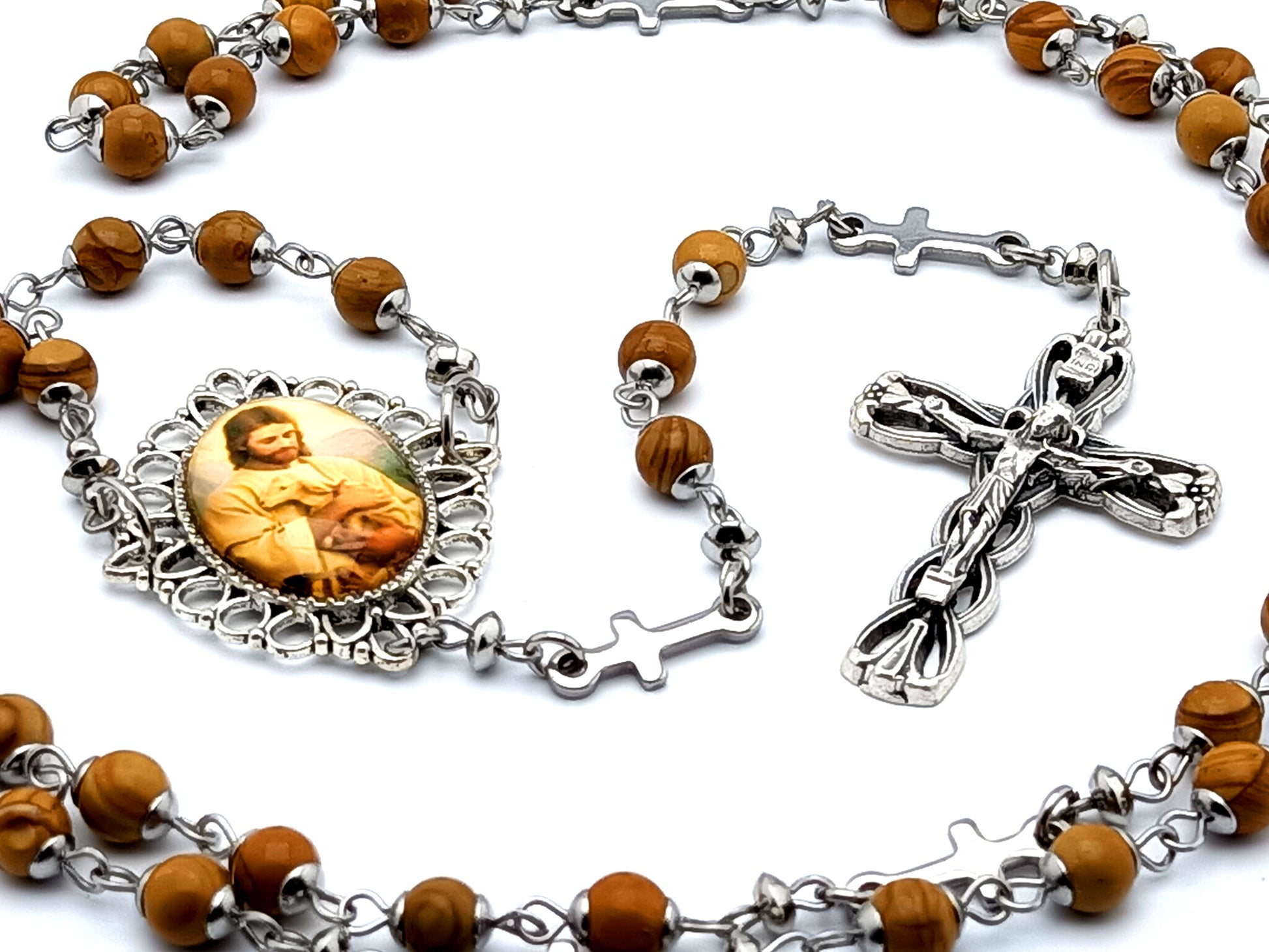 The Good Shepherd unique rosary beads with sand wood gemstone beads and stainless steel linking cross beads and a rope and heart crucifix.