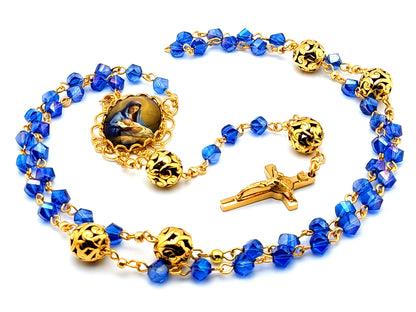The Nativity of Baby Jesus unique rosary beads with blue glass and gold beads and gold plated stainless steel Saint Benedict crucifix.