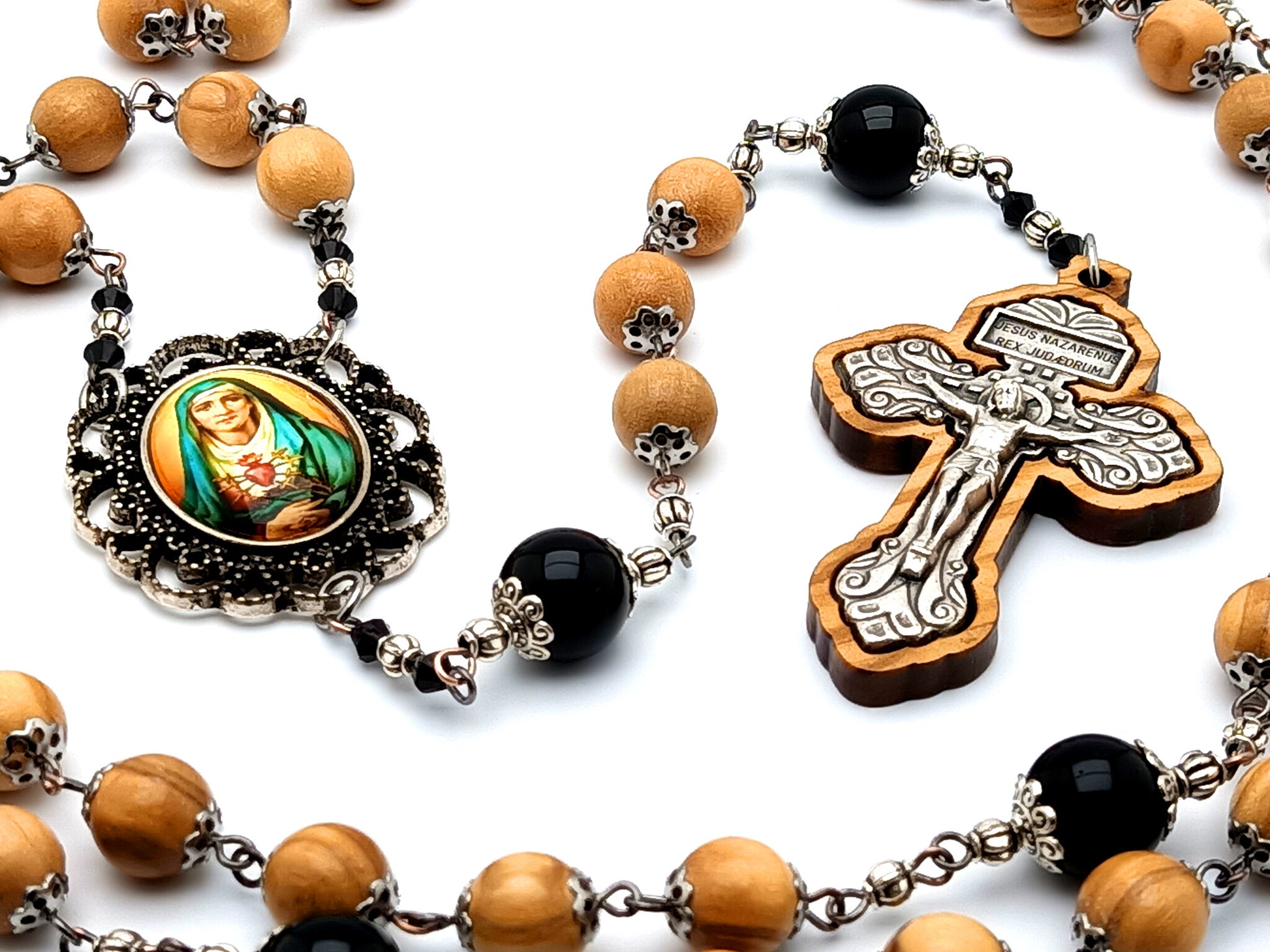 Our Lady of Sorrows unique rosary beads with olive wood and onyx gemstone beads and olive wood framed pardon crucifix.