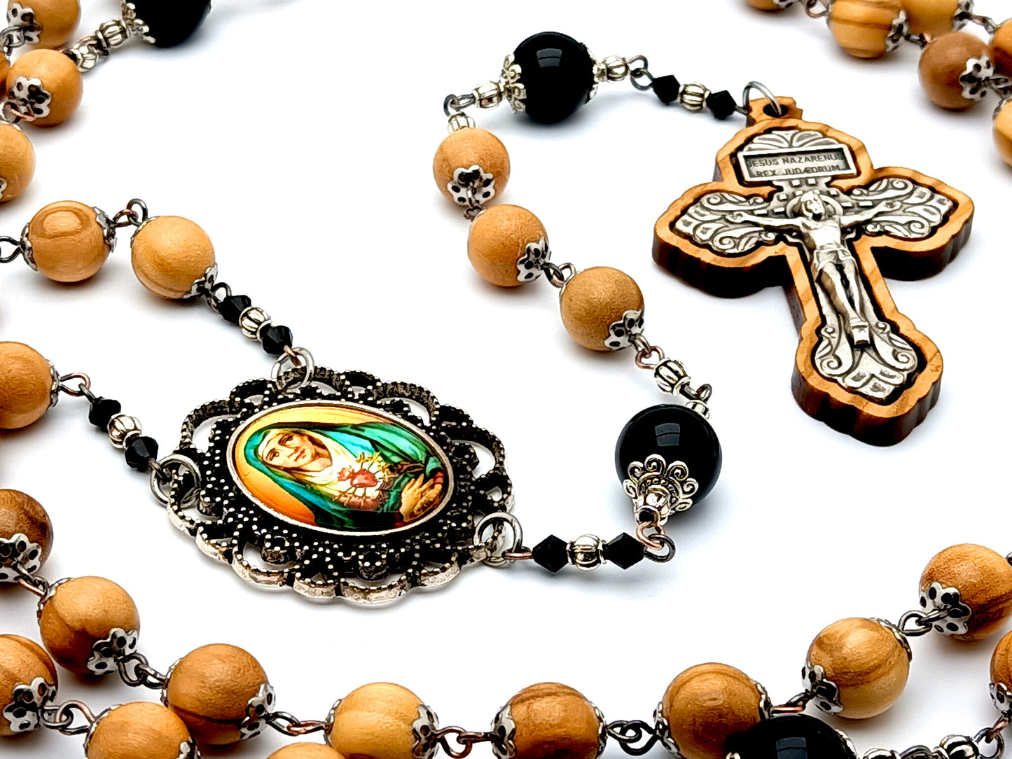 Our Lady of Sorrows unique rosary beads with olive wood and onyx gemstone beads and olive wood framed pardon crucifix.