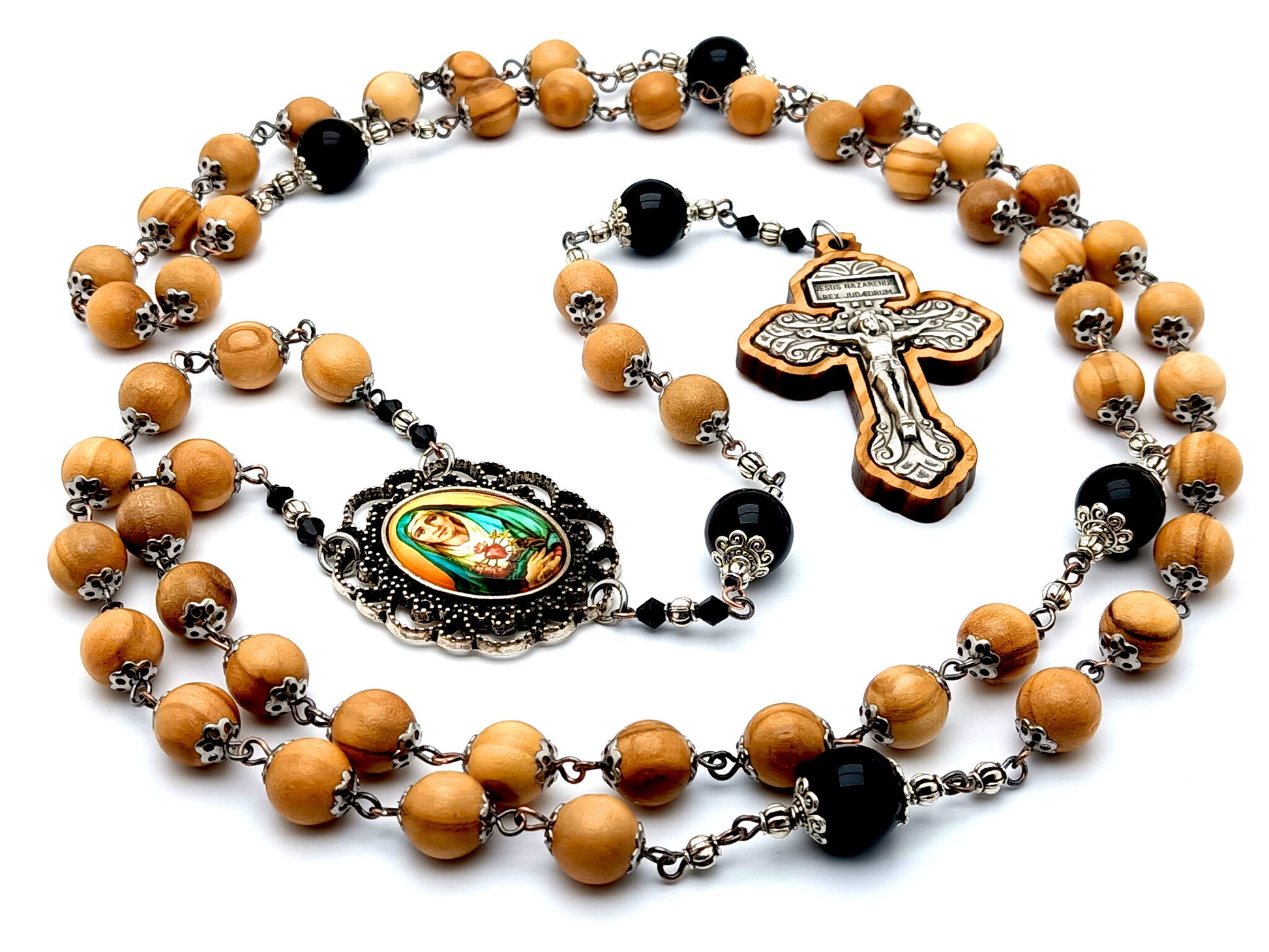 Our Lady of Sorrows unique rosary beads with olive wood and onyx gemstone beads and olive wood framed pardon crucifix.