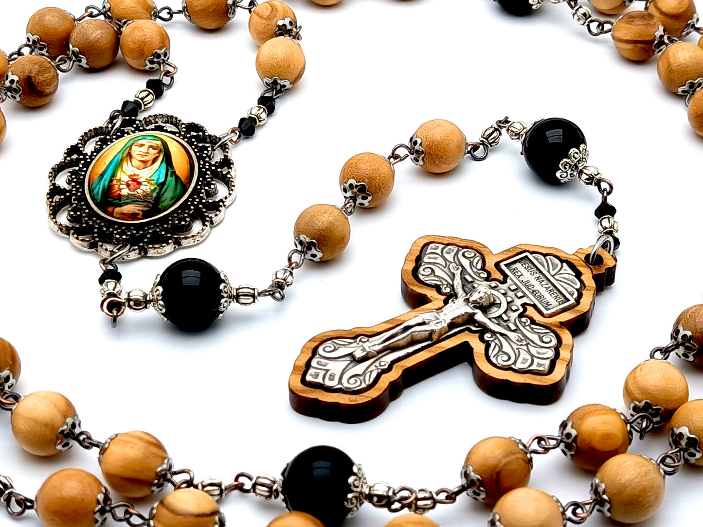 Our Lady of Sorrows unique rosary beads with olive wood and onyx gemstone beads and olive wood framed pardon crucifix.