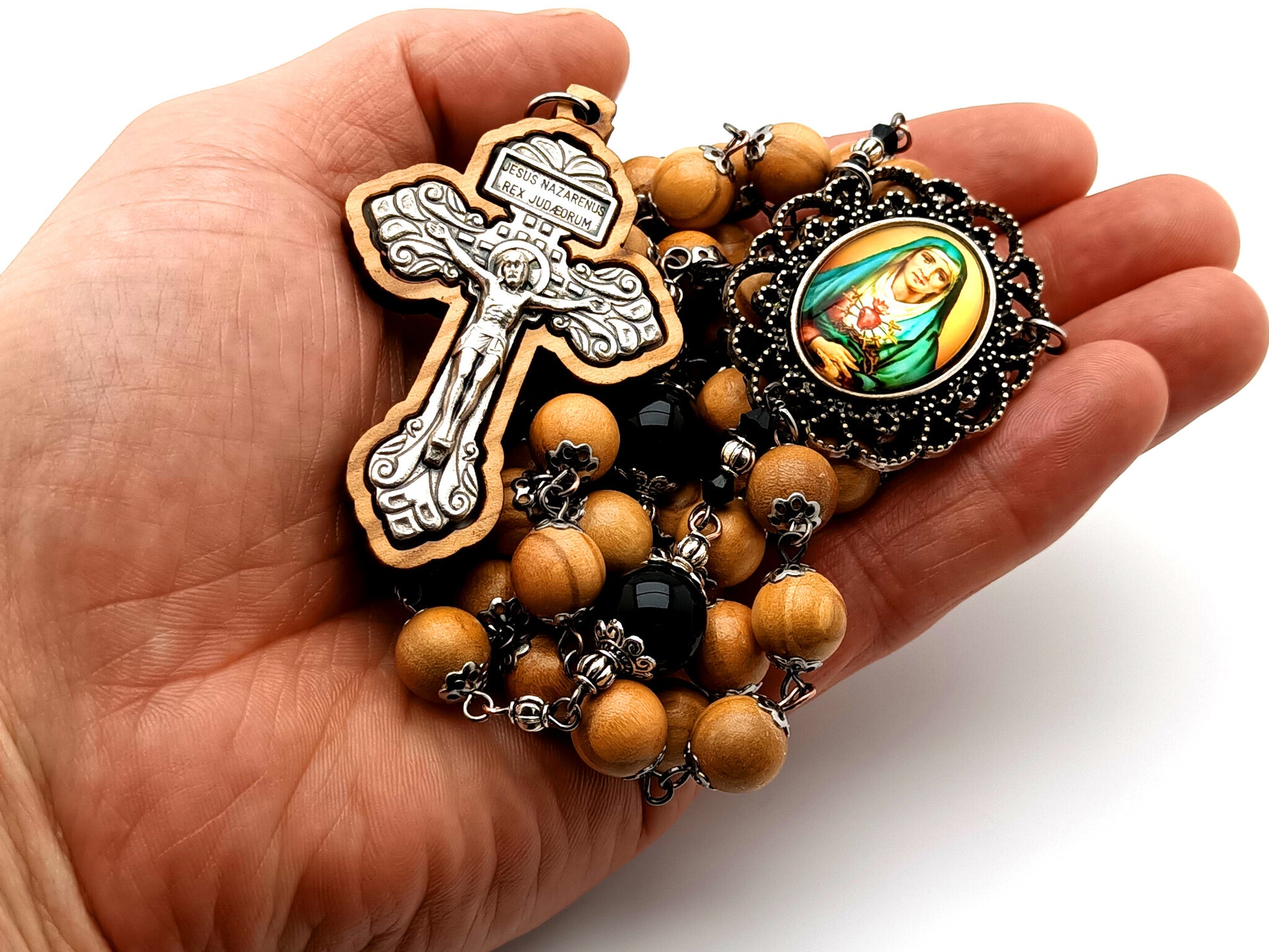 Our Lady of Sorrows unique rosary beads with olive wood and onyx gemstone beads and olive wood framed pardon crucifix.