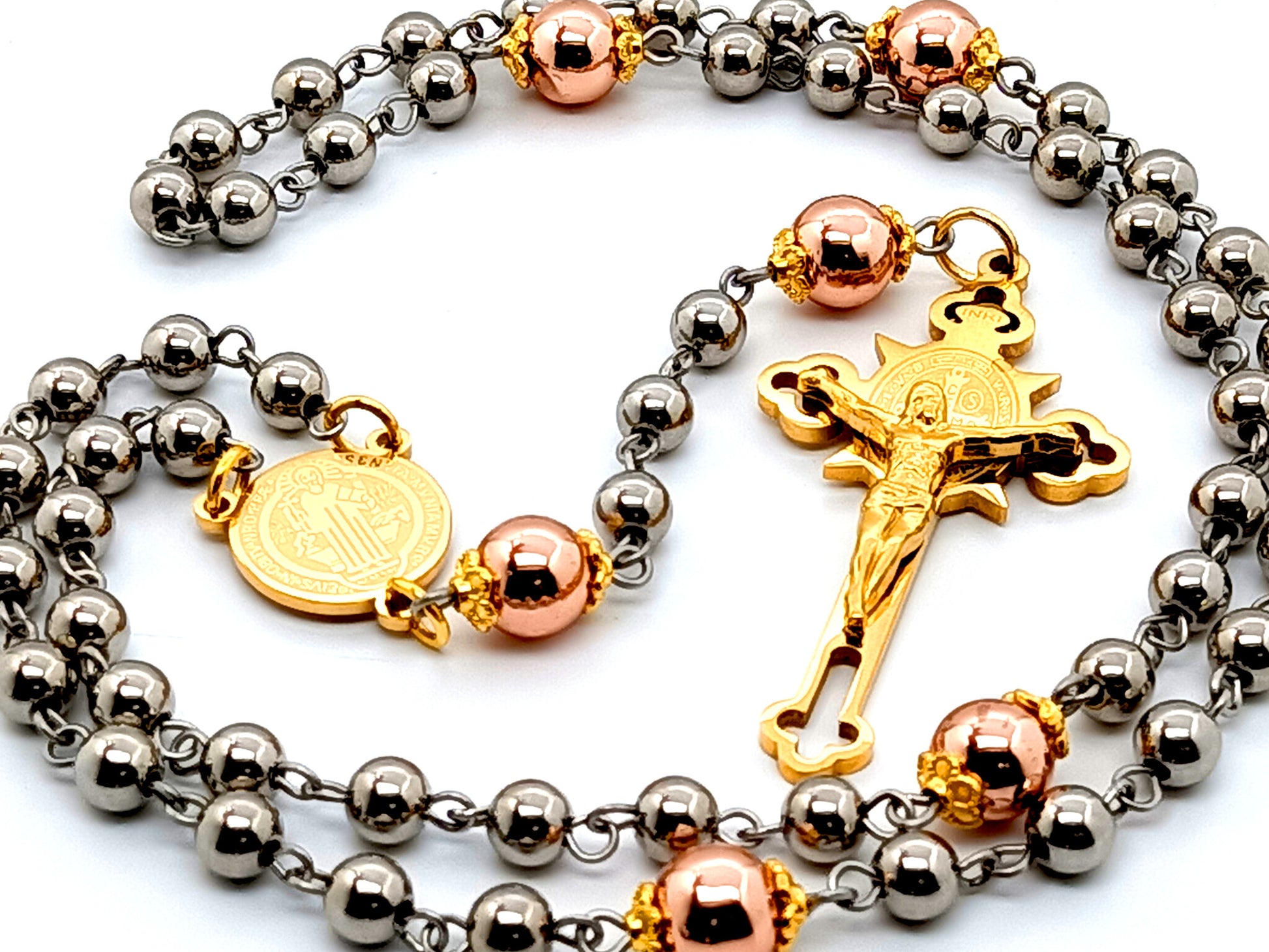 Saint Benedict unique rosary beads with stainless steel and rose gold hematite gemstone beads and etched gold plated Saint Benedict crucifix.