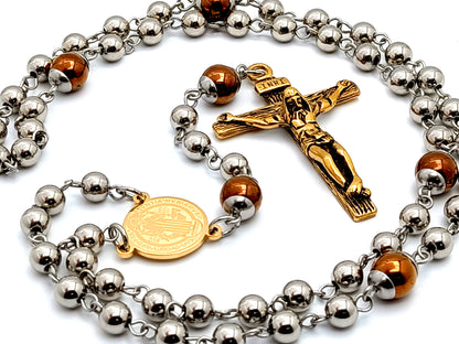 Saint Benedict unique rosary beads stainless steel and hematite gemstone rosary beads with gold plated steel crucifix and gold plated Saint Benedict medal.