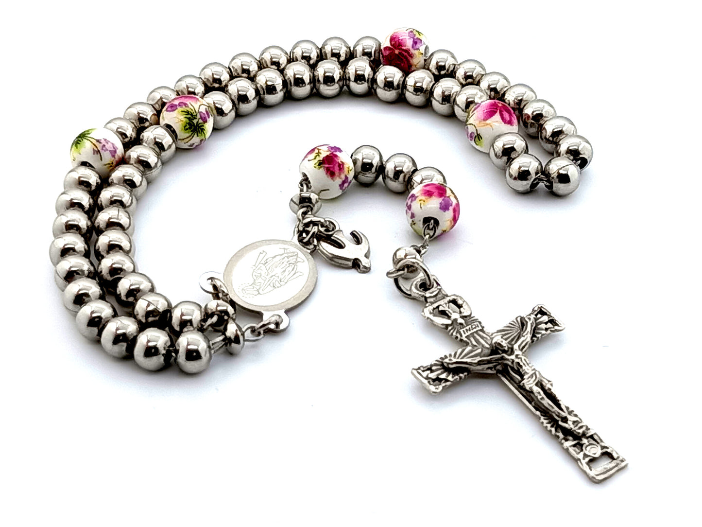 Miraculous medal stainless steel rosary beads with Holy Spirit crucifix and floral porcelain Our Father beads with Holy Spirit medal.