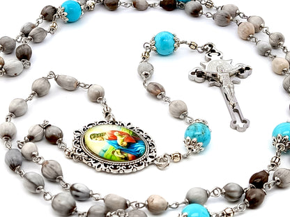 Jesus the Good Shepard unique rosary beads Jobs tears rosary beads with turquoise gemstone Our Father beads and Saint Benedict stainless steel crucifix.