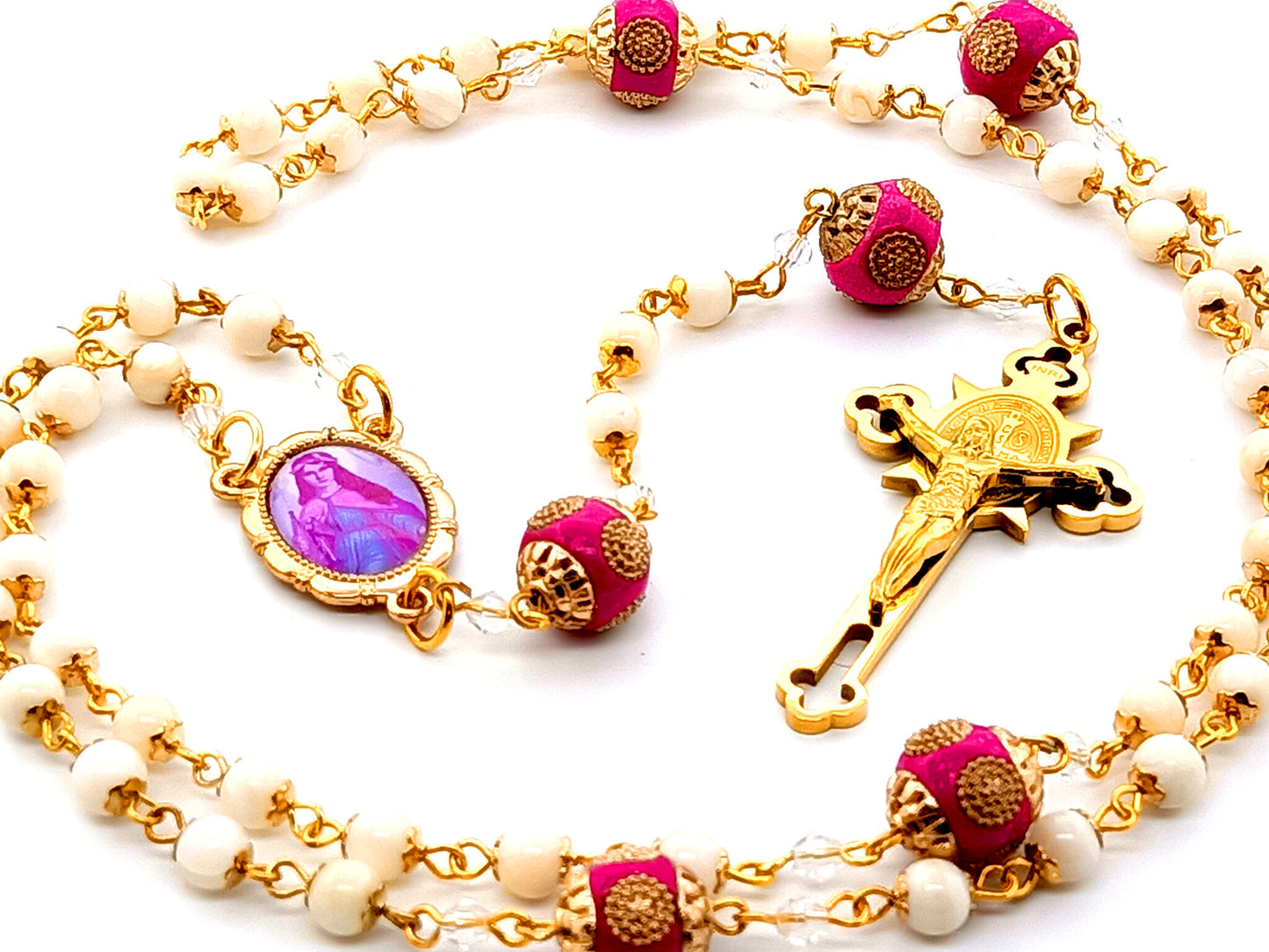 Saint Philomena unique rosary beads  mother of pearl rosary beads with Saint Benedict gold plated stainless steel crucifix and pink enamel Our Father beads.