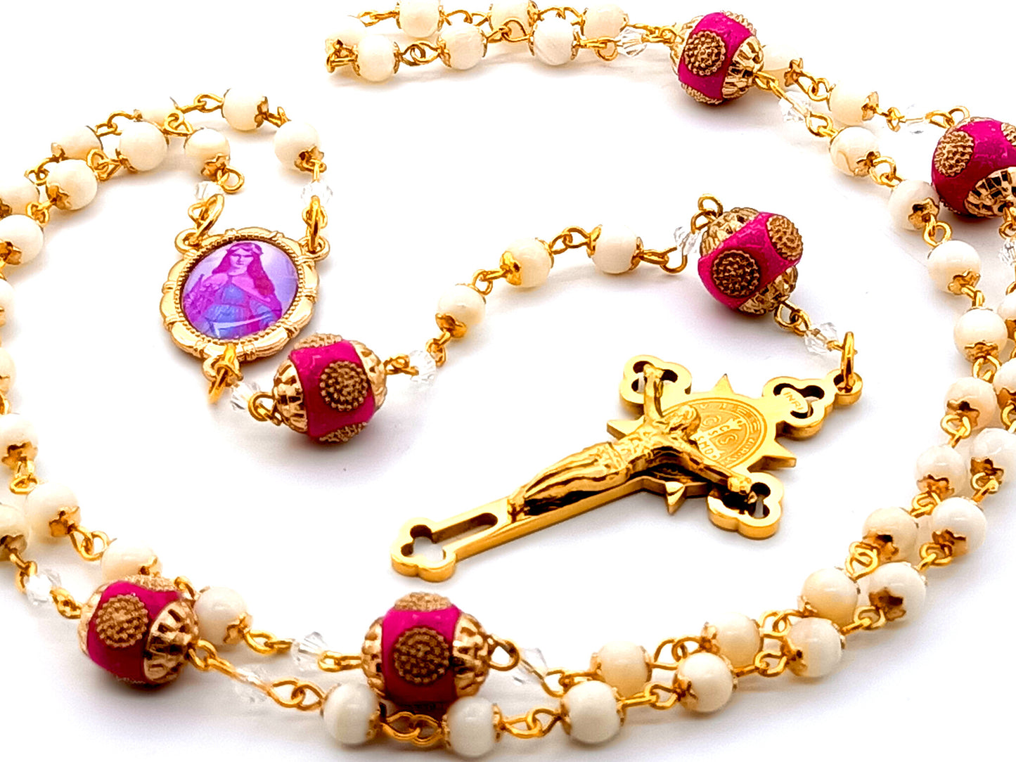 Saint Philomena unique rosary beads  mother of pearl rosary beads with Saint Benedict gold plated stainless steel crucifix and pink enamel Our Father beads.