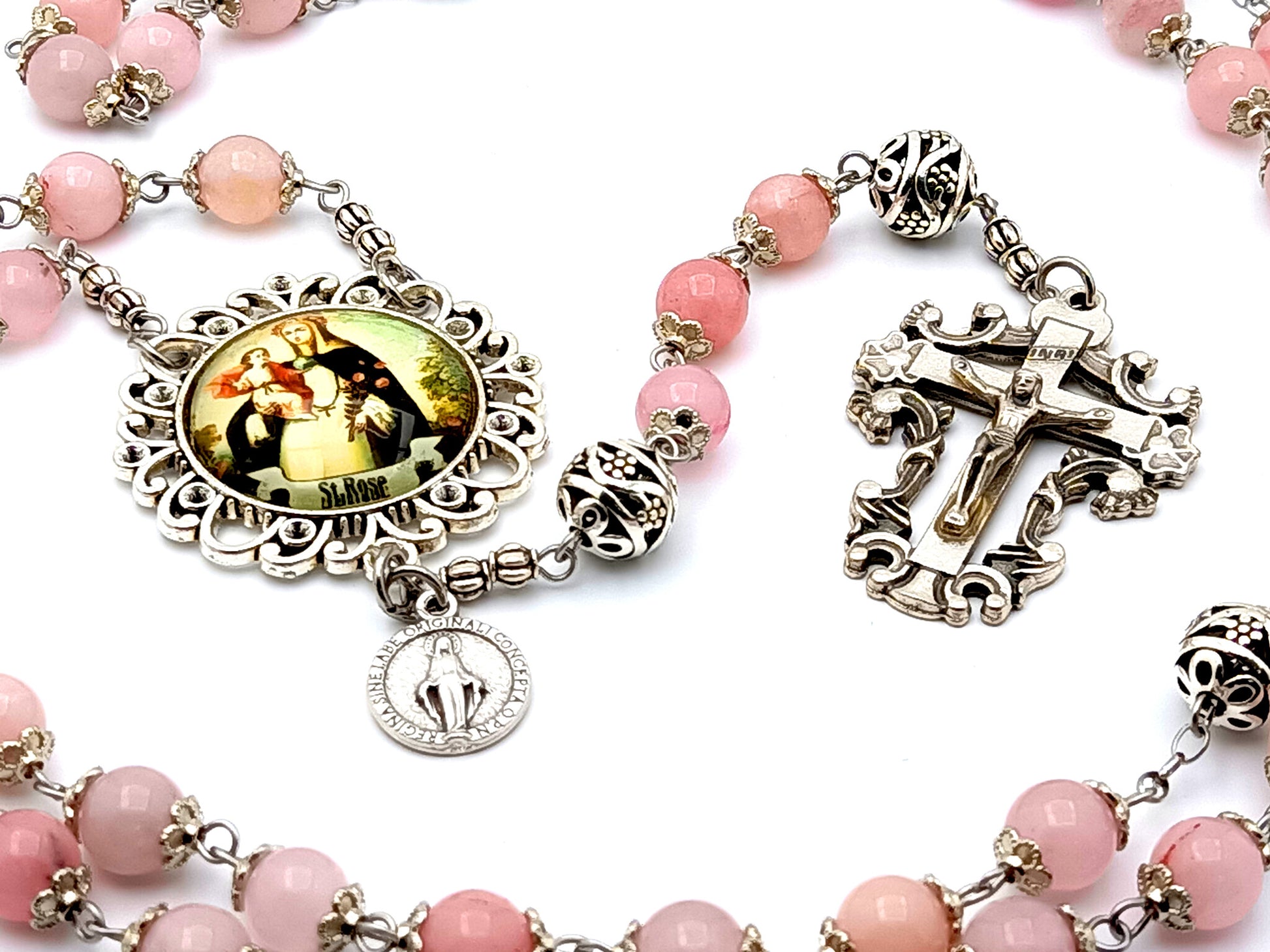 Saint Rose of Lima rose quartz gemstone rosary beads with Miraculous medal and filigree crucifix.