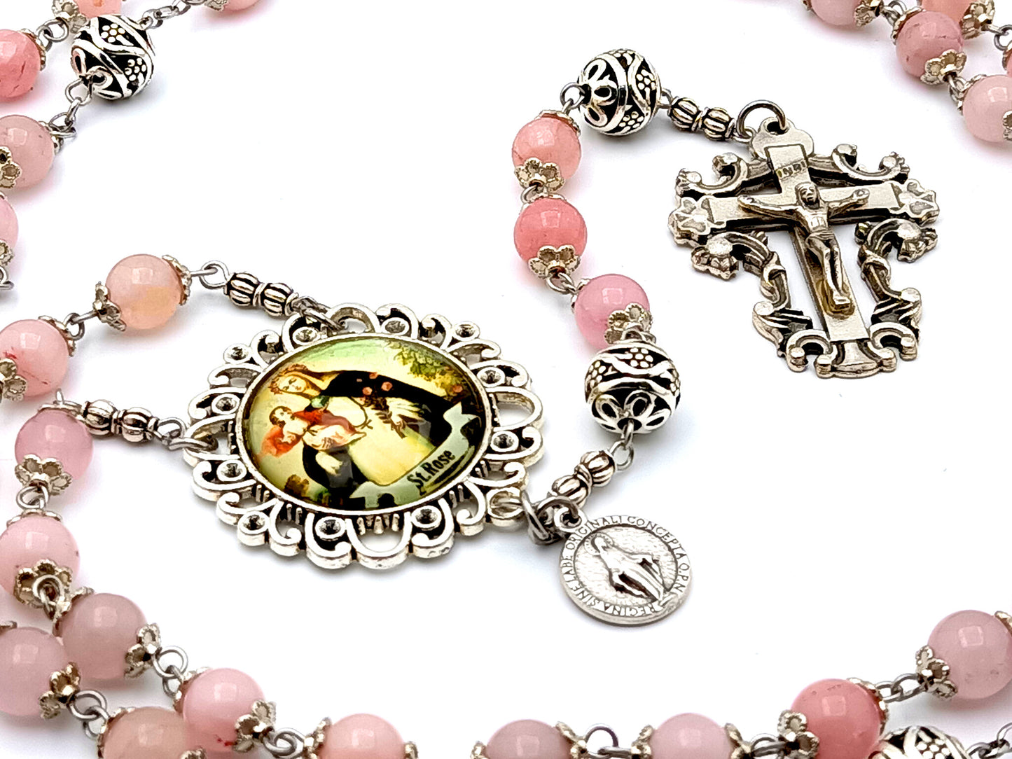 Saint Rose of Lima rose quartz gemstone rosary beads with Miraculous medal and filigree crucifix.