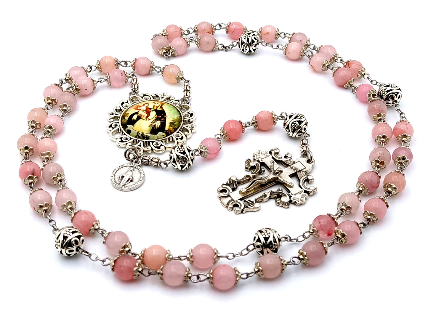 Saint Rose of Lima rose quartz gemstone rosary beads with Miraculous medal and filigree crucifix.