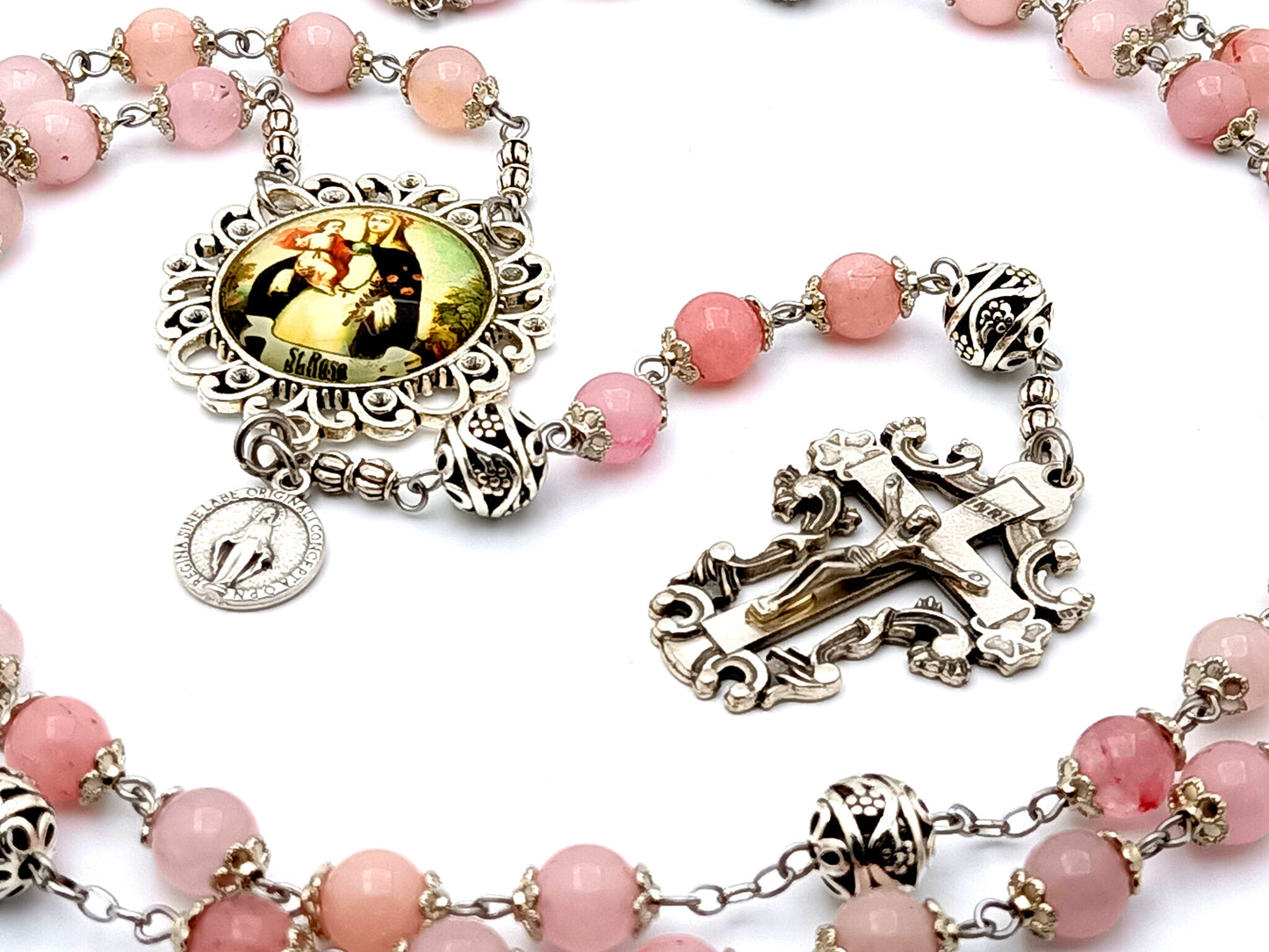 Saint Rose of Lima rose quartz gemstone rosary beads with Miraculous medal and filigree crucifix.