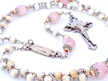 Saint Therese of Lisieux unique rosary beads mother of pearl and rose quartz gemstone rosary beads with Saint Benedict crucifix. 