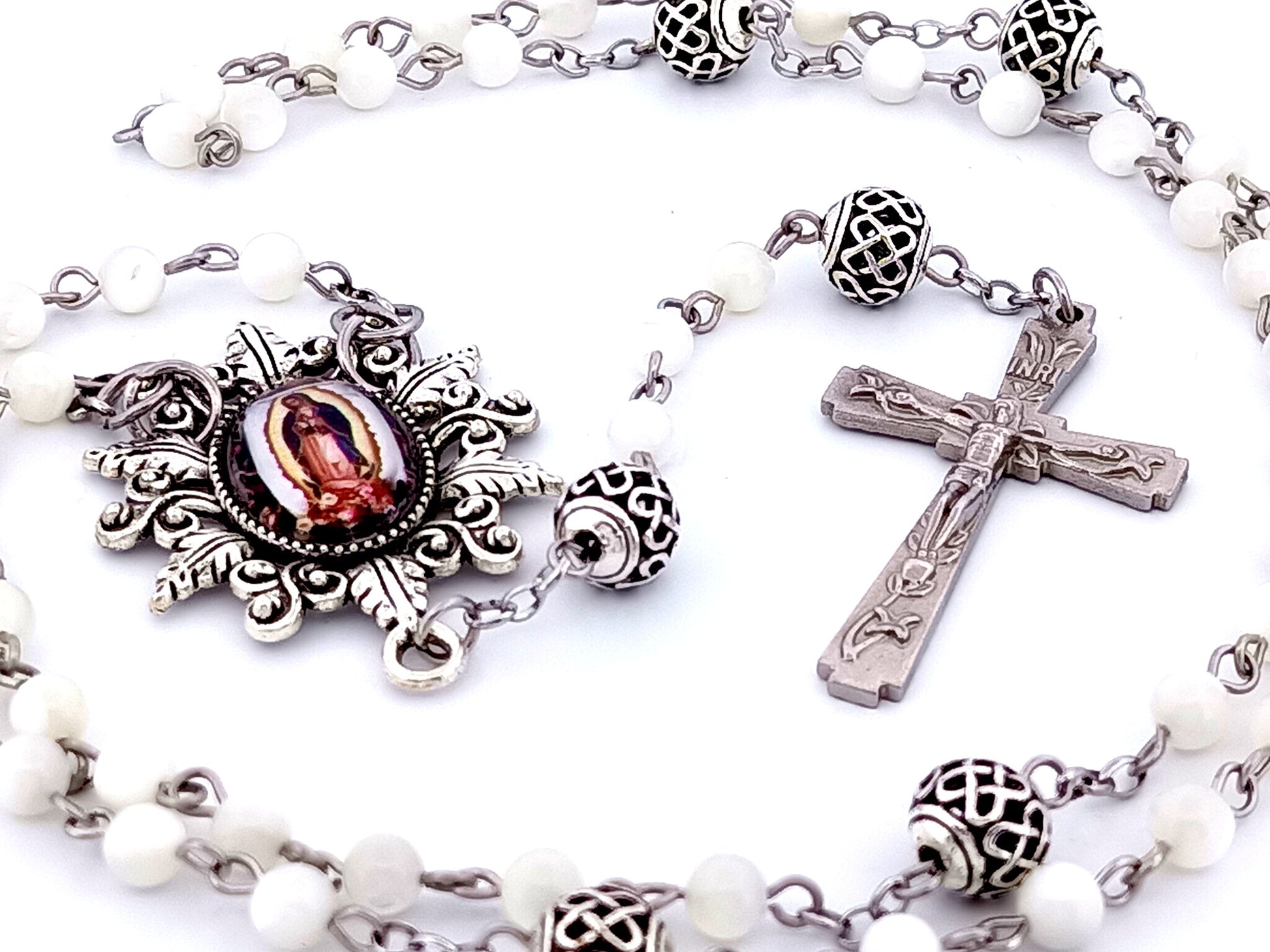 Our Lady of Guadalupe unique rosary beads mother of pearl rosary beads with lattice Our Father beads and Lily crucifix.