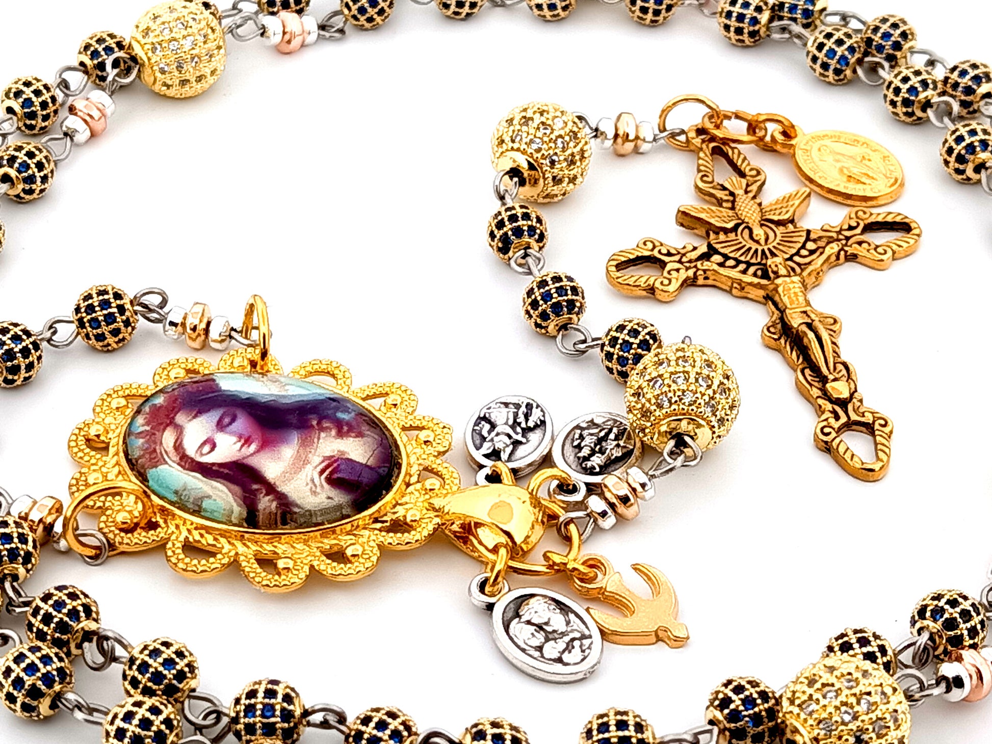 Our Lady Queen of Heaven unique rosary beads sapphire and 18K gold plated rosary with stainless steel gold plated Holy Spirit crucifix.