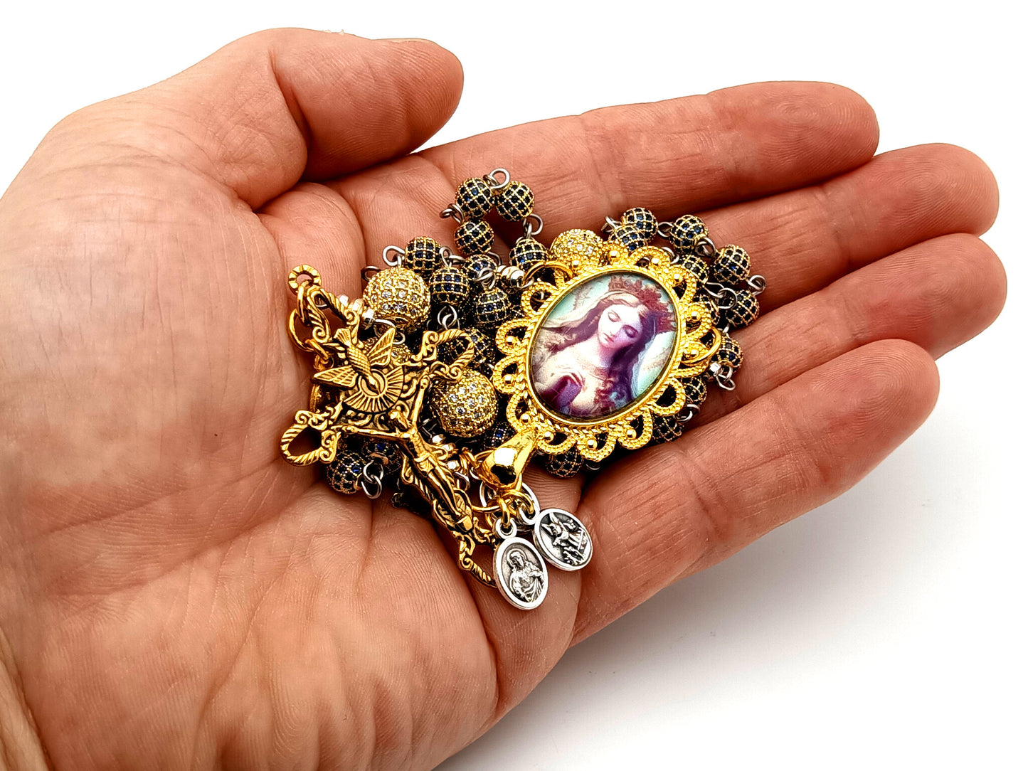 Our Lady Queen of Heaven unique rosary beads sapphire and 18K gold plated rosary with stainless steel gold plated Holy Spirit crucifix.