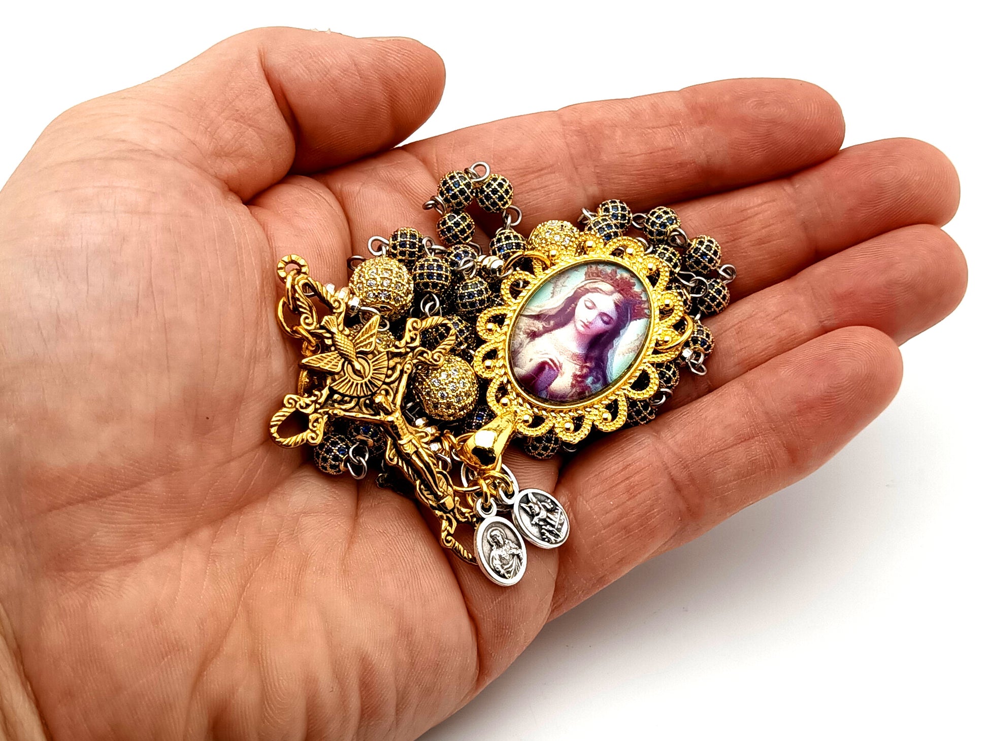 Our Lady Queen of Heaven unique rosary beads sapphire and 18K gold plated rosary with stainless steel gold plated Holy Spirit crucifix.