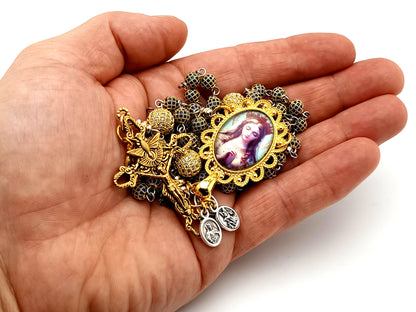 Our Lady Queen of Heaven unique rosary beads sapphire and 18K gold plated rosary with stainless steel gold plated Holy Spirit crucifix.