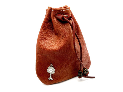 Light brown real leather rosary pouch with draw string and small Eucharistic crucifix and internal lobster clasp.