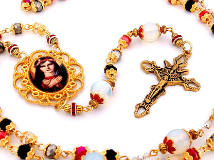 Saint Philomena unique rosary beads glass and gemstone rosary with gold plated stainless steel Holy Spirit crucifix.