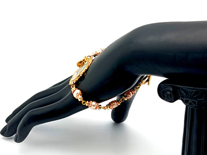 Our Lady of Charity unique rosary beads pink fresh water pearl rosary bracelet with gold Miraculous medal and cross.