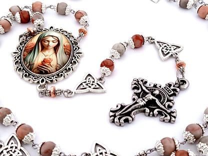 Our Lady with roses unique rosary beads rhodonite gemstone and Holy Trinity medals beads with stainless steel filigree crucifix.