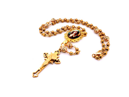 Our Lady at prayer unique rosary beads gold plated stainless steel and 18K gold plated cubic zirconia rosary with gold plated Saint Benedict crucifix.