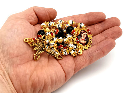 Saint Philomena unique rosary beads floral porcelain and onyx gemstone rosary with gold plated Holy Spirit crucifix.