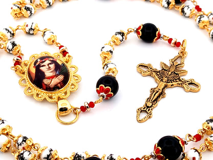 Saint Philomena unique rosary beads floral porcelain and onyx gemstone rosary with gold plated Holy Spirit crucifix.