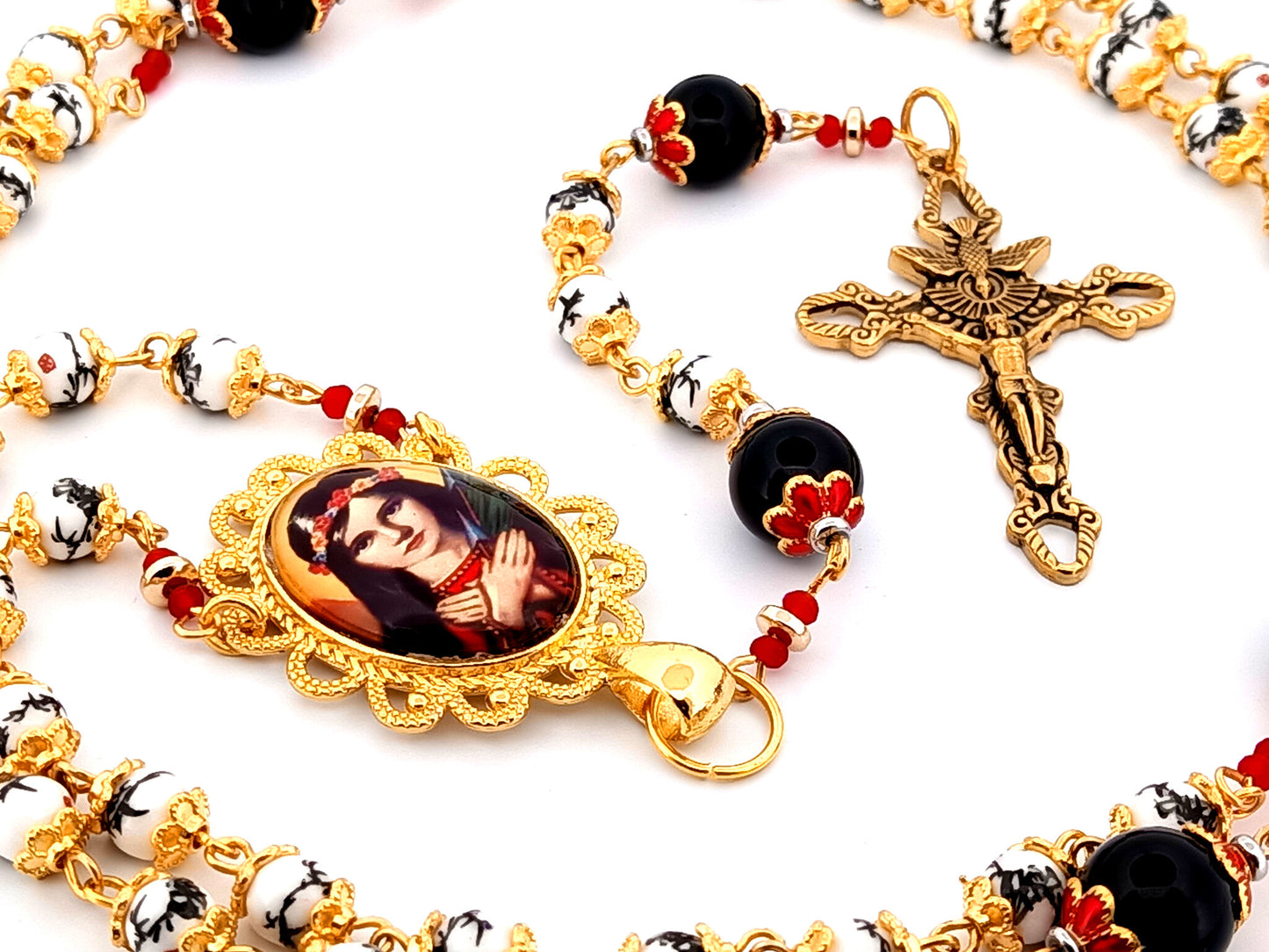 Saint Philomena unique rosary beads floral porcelain and onyx gemstone rosary with gold plated Holy Spirit crucifix.