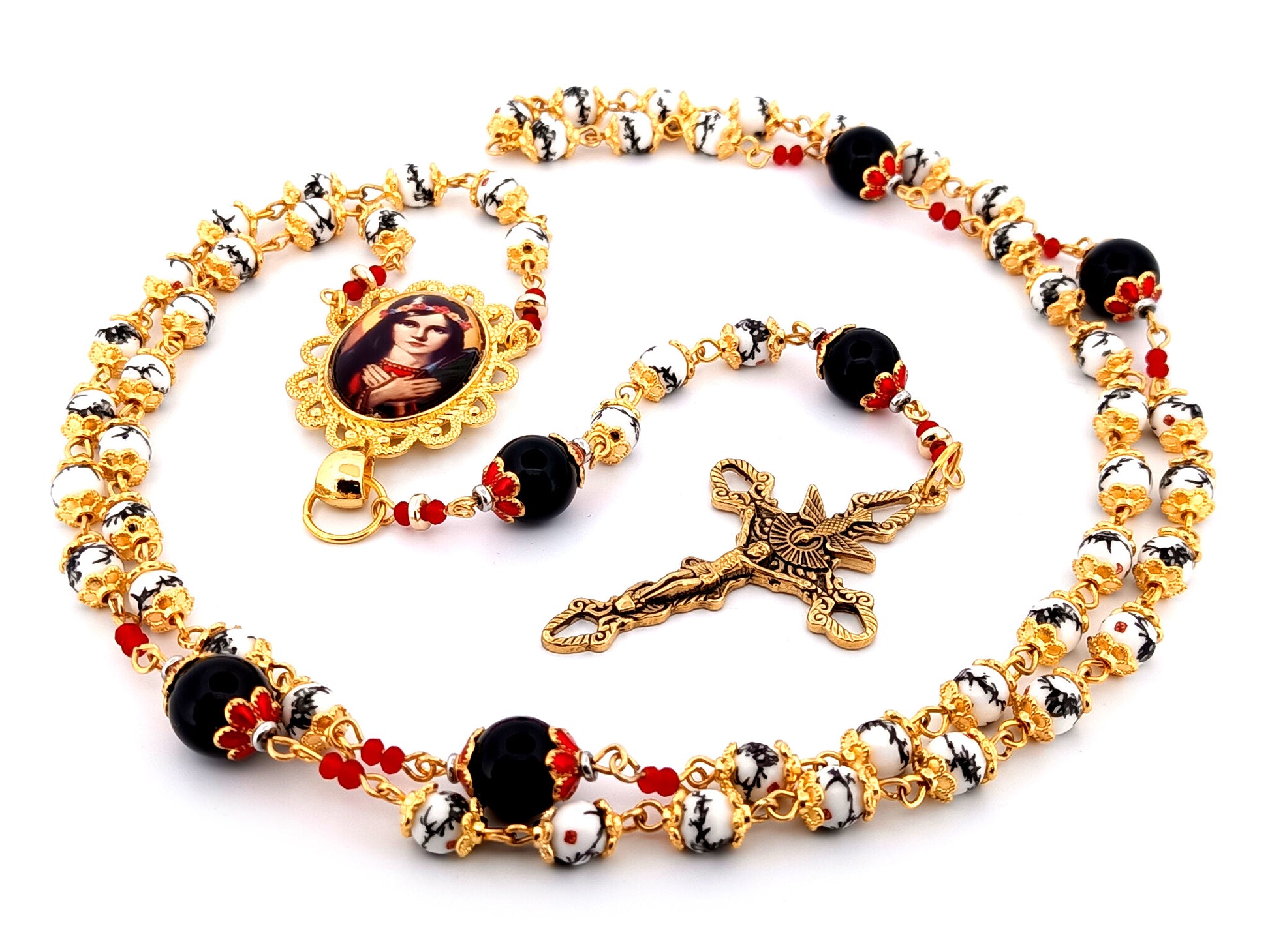 Saint Philomena unique rosary beads floral porcelain and onyx gemstone rosary with gold plated Holy Spirit crucifix.