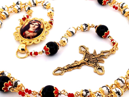 Saint Philomena unique rosary beads floral porcelain and onyx gemstone rosary with gold plated Holy Spirit crucifix.