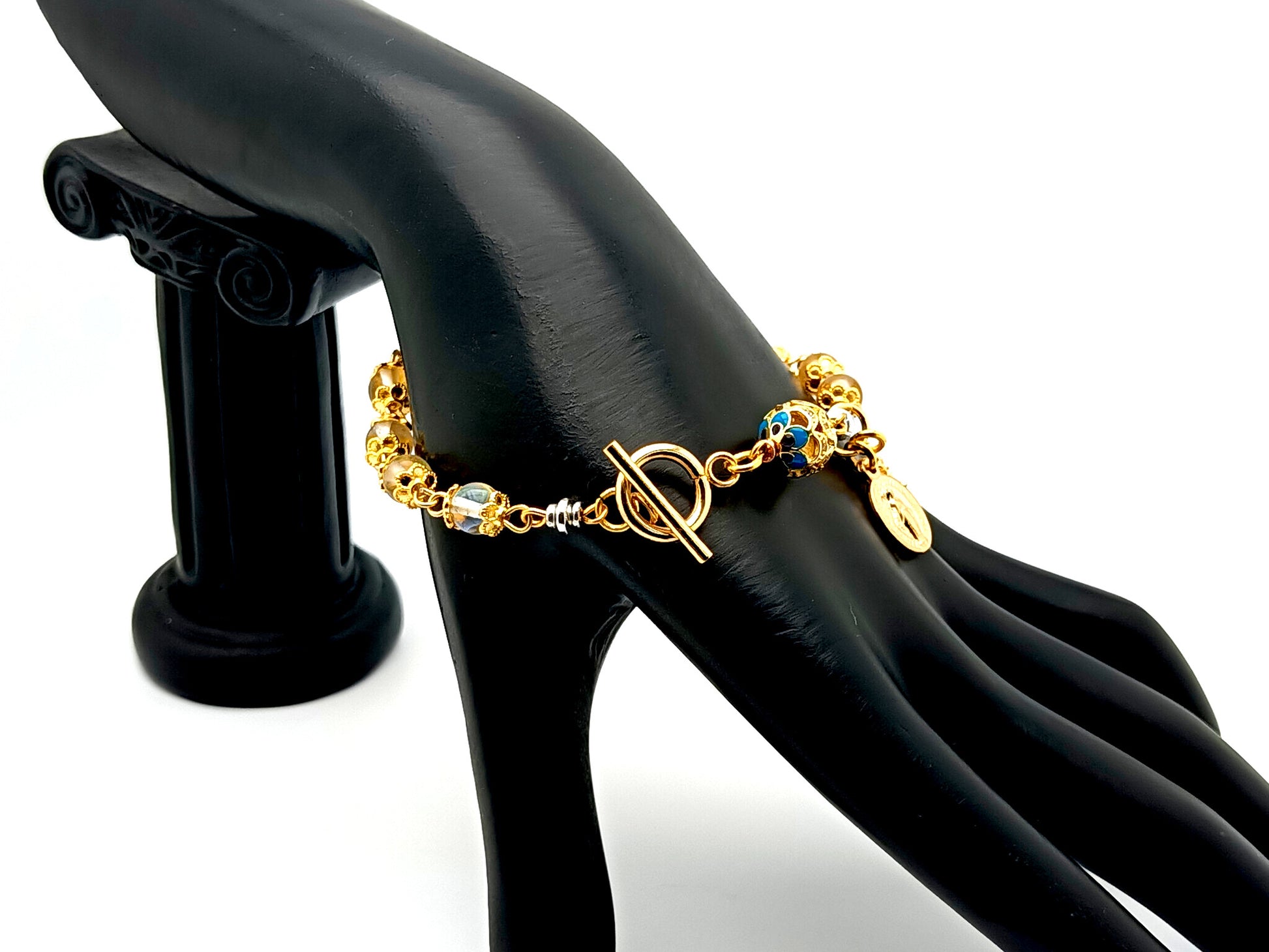 Miraculous medal unique rosary beads angel aura crystal gemstone and 18K gold single decade rosary bracelet with gold plated crucifix.