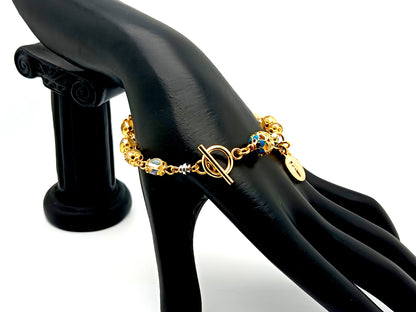 Miraculous medal unique rosary beads angel aura crystal gemstone and 18K gold single decade rosary bracelet with gold plated crucifix.