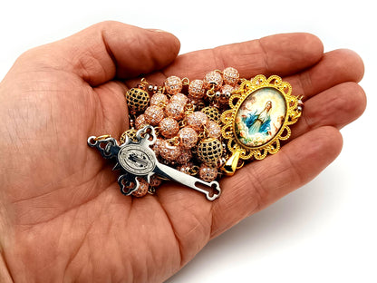 Our Lady Queen of Heaven unique rosary beads rose gold and 18K gold plated cubic zirconia rosary with gold plated Saint Benedict crucifix.