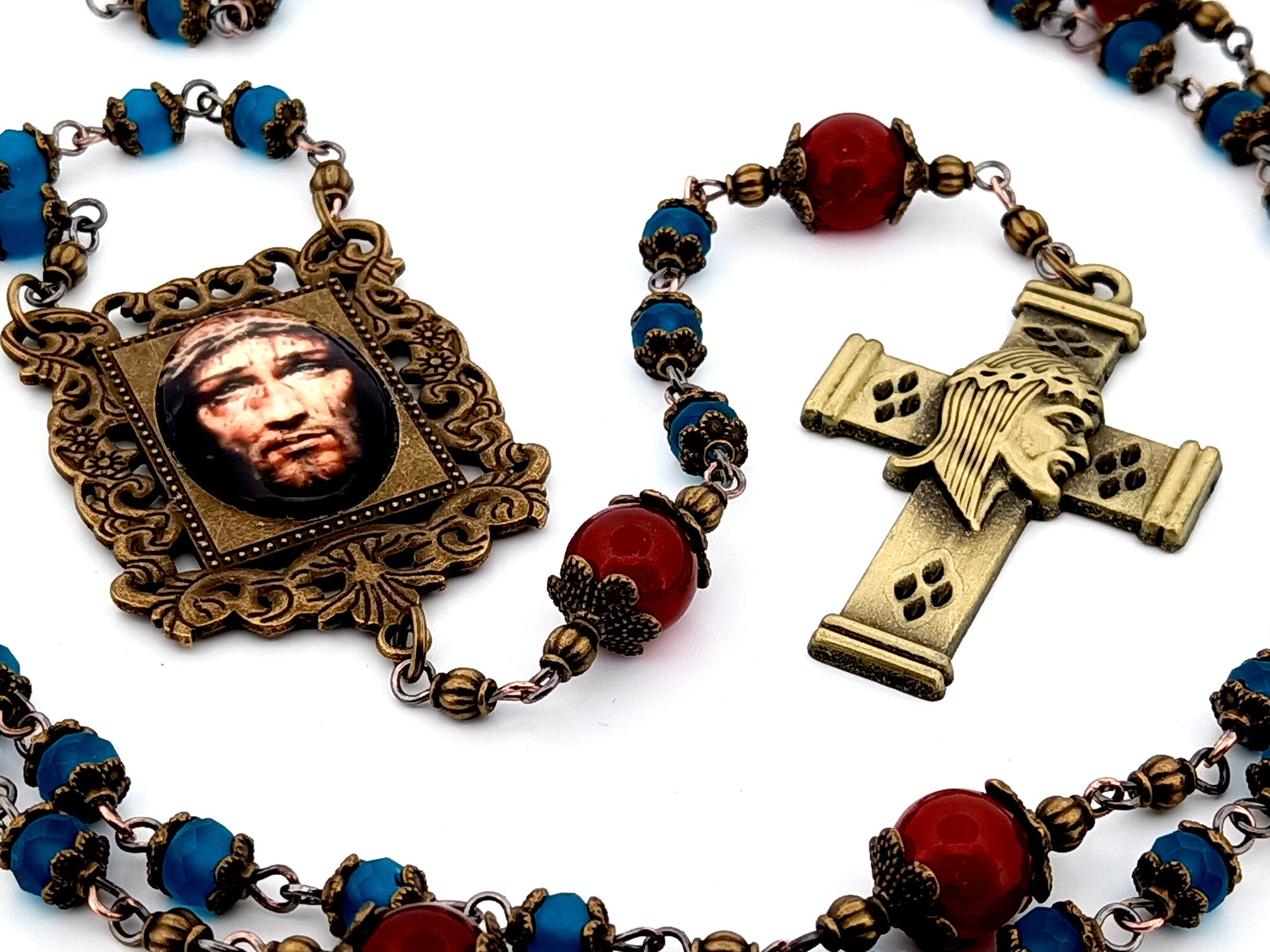 Holy Face of Jesus unique rosary beads faceted blue and red glass rosary with brass Holy Face crucifix.