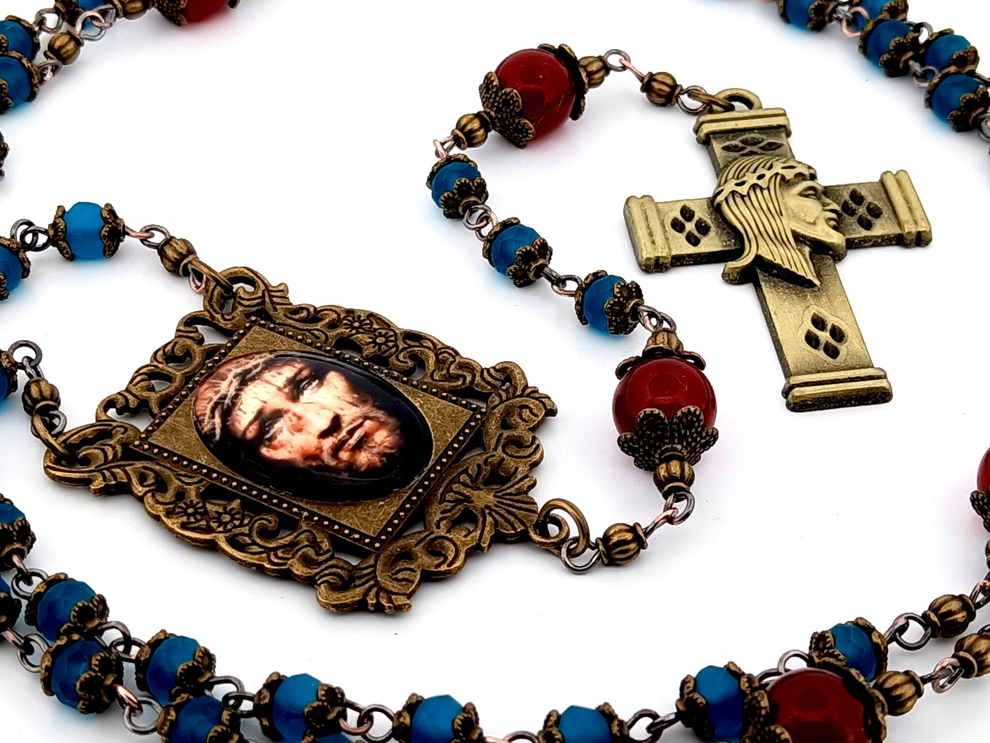 Holy Face of Jesus unique rosary beads faceted blue and red glass rosary with brass Holy Face crucifix.