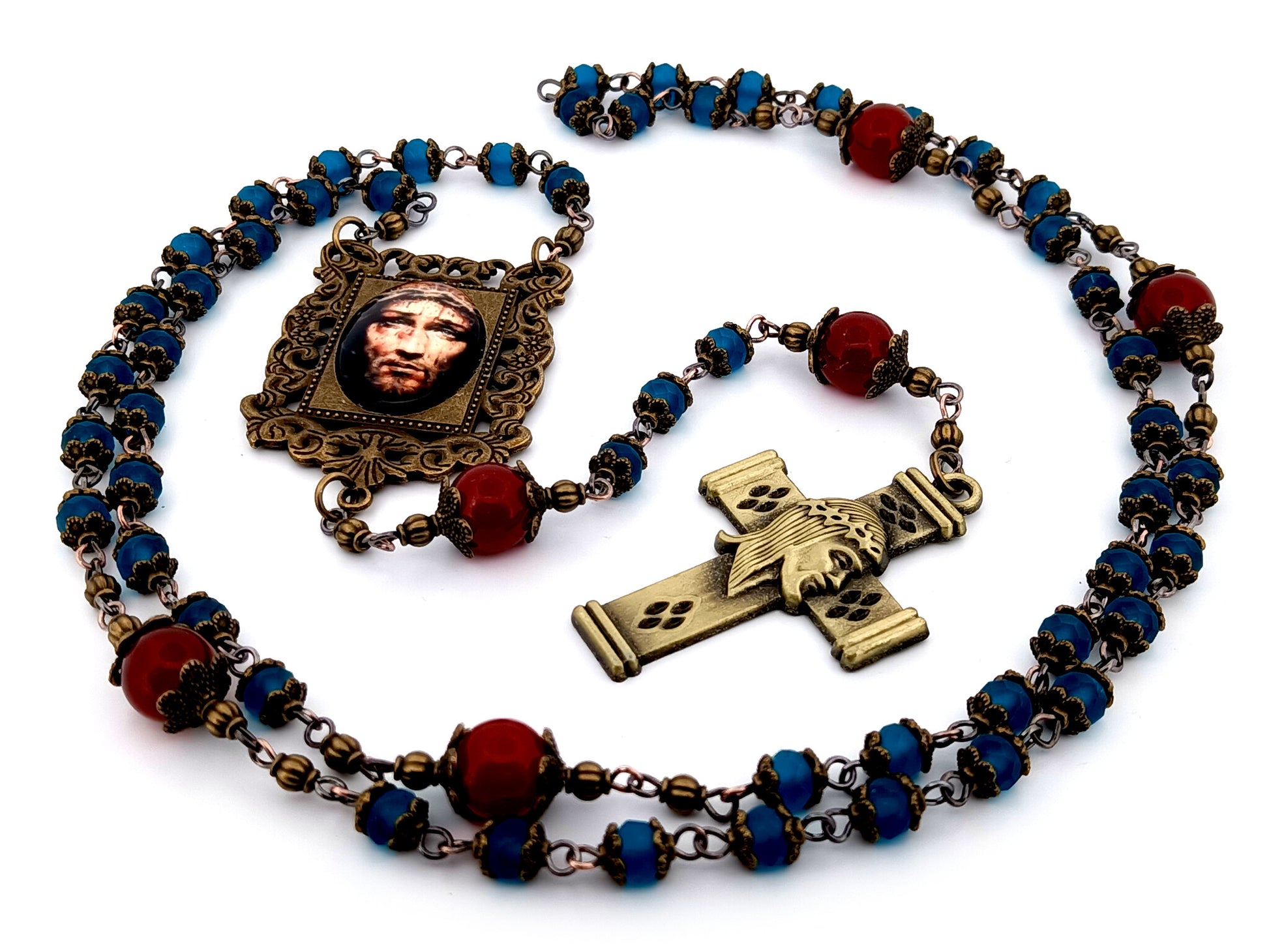 Holy Face of Jesus unique rosary beads faceted blue and red glass rosary with brass Holy Face crucifix.