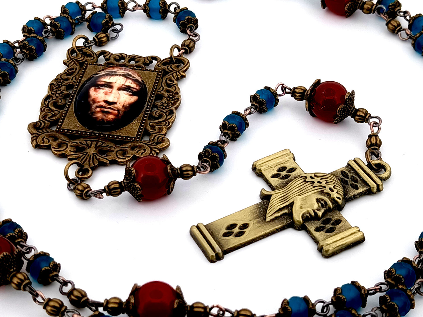 Holy Face of Jesus unique rosary beads faceted blue and red glass rosary with brass Holy Face crucifix.