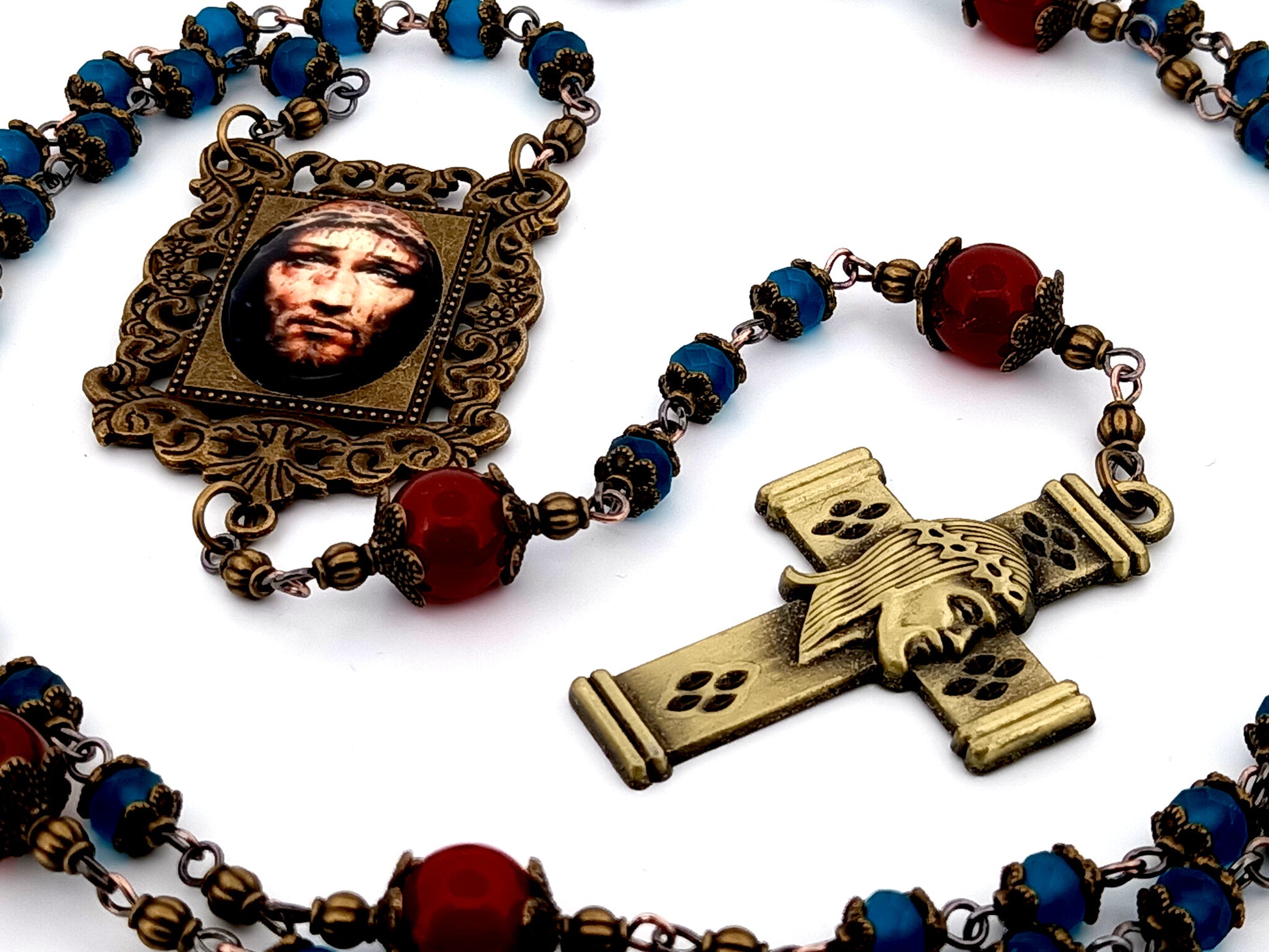 Holy Face of Jesus unique rosary beads faceted blue and red glass rosary with brass Holy Face crucifix.