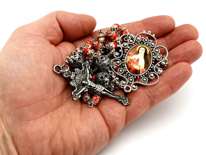 Saint Teresa of Lisieux unique rosary beads floral porcelain and silver rosary with sunburst crucifix.