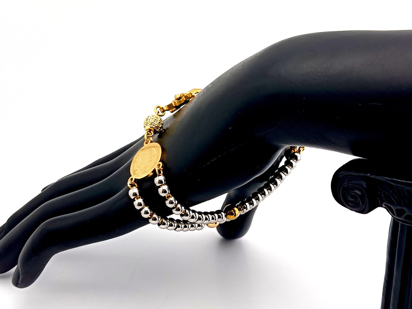 Miraculous Medal unique rosary beads gold plated cubic zirconia and stainless steel single decade rosary bracelet with gold plated Saint Benedict crucifix.