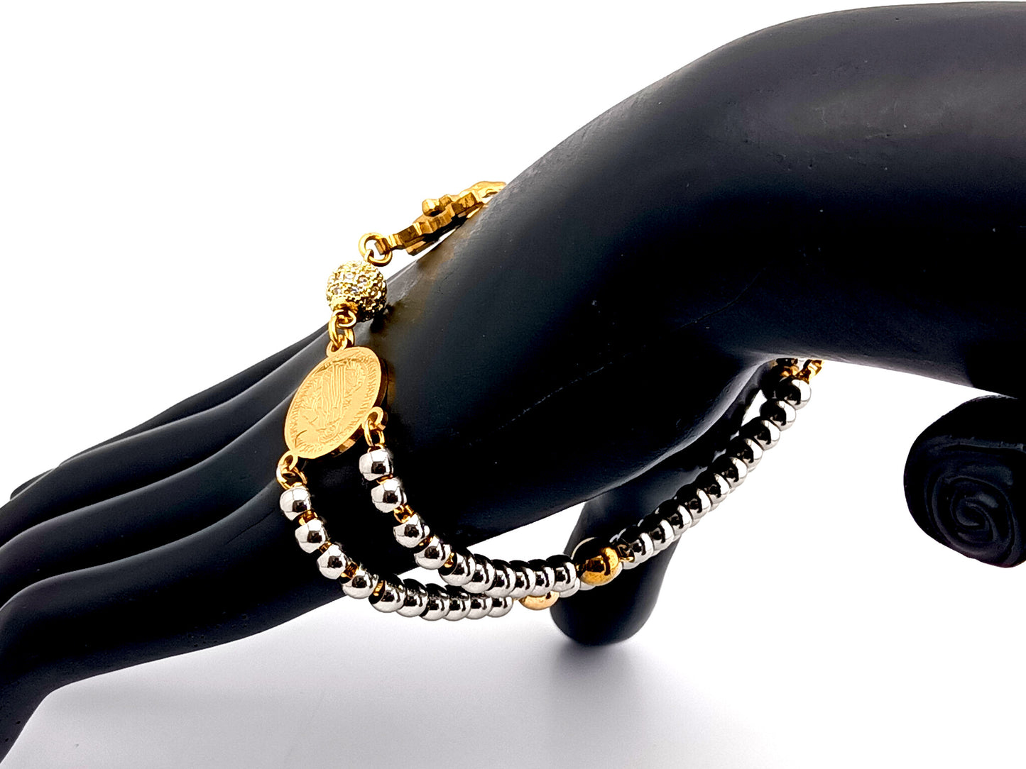 Miraculous Medal unique rosary beads gold plated cubic zirconia and stainless steel single decade rosary bracelet with gold plated Saint Benedict crucifix.