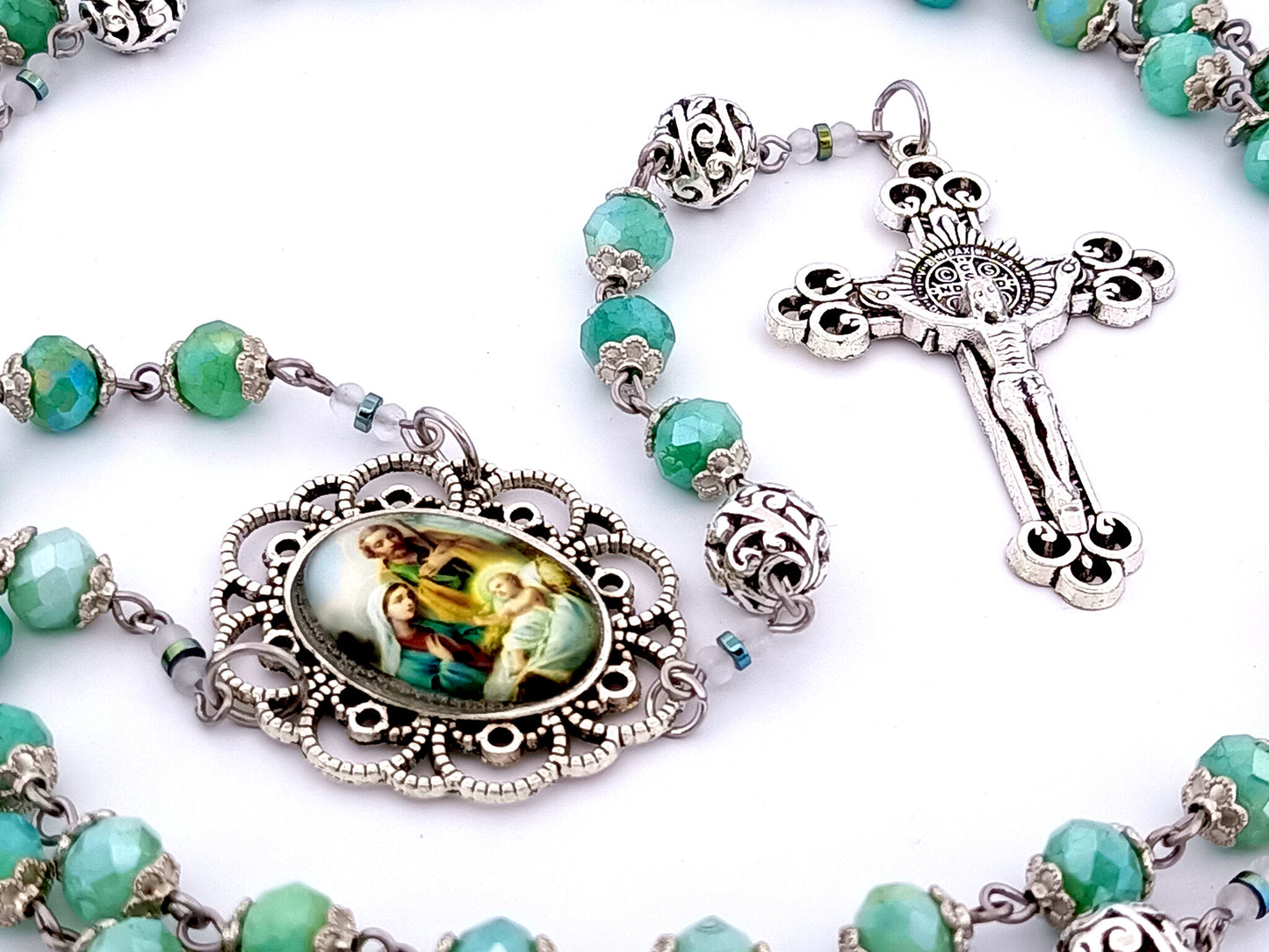 Holy Family unique rosary beads faceted aqua glass and silver rosary with Saint Benedict crucifix.